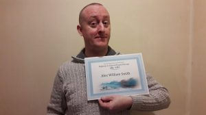 Alex Smith Proudly Holding his Professional Clinical Hypnotherapy Diploma from Susan Lawrence which is GHR & GHSC Endorsed.